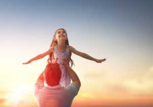 Happy loving family. Father and his daughter child girl playing outdoors. Cute little girl and daddy. Concept of Father's day.